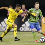 Columbus Crew's Artur, left, chases Seattle Sounders' Harry Shipp during the second half of an MLS soccer match Saturday, July 6, 2019, in Columbus, Ohio. The Sounders won 2-1. (AP Photo/Jay LaPrete)