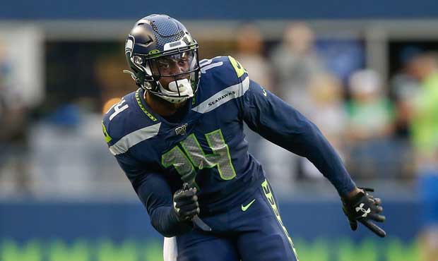 DK Metcalf of the Seattle Seahawks reacts after diving to make a