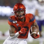 Arizona wide receiver Jamarye Joiner (10) scores a touchdown against Washington during the first half of an NCAA college football game Saturday, Oct. 12, 2019, in Tucson, Ariz. (AP Photo/Rick Scuteri)