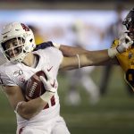 Washington State's Max Borghi, left, straight-arms California's Evan Weaver (89) during the first half of an NCAA college football game Saturday, Nov. 9, 2019, in Berkeley, Calif. (AP Photo/Ben Margot)