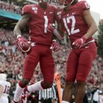Washington State wide receiver Davontavean Martin (1) celebrates his touchdown with wide receiver Dezmon Patmon (12) during the first half of an NCAA college football game against Stanford in Pullman, Wash., Saturday, Nov. 16, 2019. (AP Photo/Young Kwak)