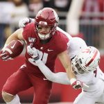 Washington State running back Max Borghi, left, carries the ball while pressured by Stanford cornerback Kyu Blu Kelly during the first half of an NCAA college football game in Pullman, Wash., Saturday, Nov. 16, 2019. (AP Photo/Young Kwak)