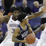 Washington's Isaiah Stewart, left, defends against Mount St. Mary's Damian Chong Qui during the first half of an NCAA college basketball game Tuesday, Nov. 12, 2019, in Seattle. (AP Photo/Elaine Thompson)