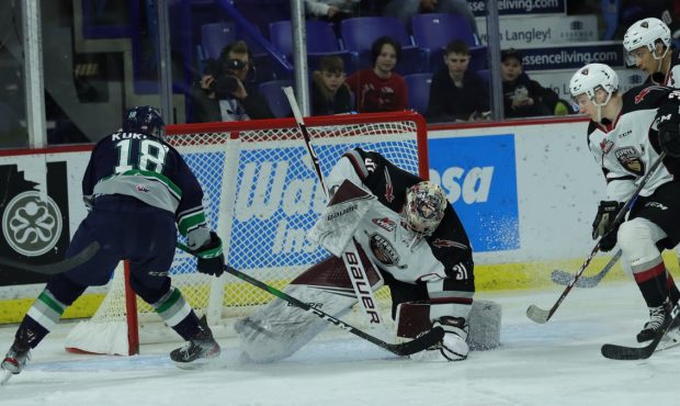 Andrej Kukuca of the Seattle Thunderbirds tries to get a shot past Vancouver's Trent Miner. (Rob Wi...