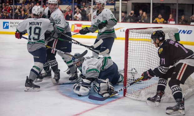 Roddy Ross dives on the puck during the Thunderbirds shootout win in Portland (Hunter Radcliffe/ Wi...