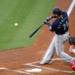 ANAHEIM, CA - JULY 30: José Marmolejos #26 of the Seattle Mariners hits a three run home run in the first inning of the game against the Los Angeles Angels at Angel Stadium of Anaheim on July 30, 2020 in Anaheim, California. (Photo by Jayne Kamin-Oncea/Getty Images)