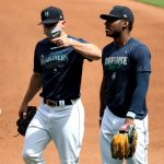 SEATTLE, WASHINGTON - JULY 03:  (L-R) Kyle Seager #15 and Kyle Lewis #1 of the Seattle Mariners have a conversation during summer workouts at T-Mobile Park on July 03, 2020 in Seattle, Washington. (Photo by Abbie Parr/Getty Images)