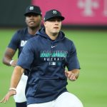 SEATTLE, WASHINGTON - JULY 03: Evan White #12 (front) participates in drills alongside Kyle Lewis #1 of the Seattle Mariners during summer workouts at T-Mobile Park on July 03, 2020 in Seattle, Washington. (Photo by Abbie Parr/Getty Images)