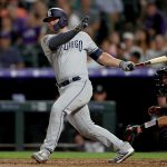 DENVER, COLORADO - SEPTEMBER 13: Ty France #11 of the San Diego Padres hits a 2 RBI single in the sixth inning against the Colorado Rockies at Coors Field on September 13, 2019 in Denver, Colorado. (Photo by Matthew Stockman/Getty Images)
