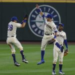 SEATTLE, WA - AUGUST 23: (L-R) Sam Haggerty #28 of the Seattle Mariners, Braden Bishop #5 and Kyle Lewis #1 celebrate in the outfield after a game against the Texas Rangers at T-Mobile Park on August 23, 2020 in Seattle, Washington. The Mariners won 4-1. (Photo by Stephen Brashear/Getty Images)