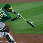 SEATTLE, WA - SEPTEMBER 14:  Ramon Laureano #22 of the Oakland Athletics connects with a two-run double against the Seattle Mariners during the third inning in the second game of a doubleheader at T-Mobile Park on September 14, 2020 in Seattle, Washington. (Photo by Lindsey Wasson/Getty Images)