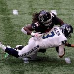 ATLANTA, GEORGIA - SEPTEMBER 13:  Takkarist McKinley #98 of the Atlanta Falcons sacks Russell Wilson #3 of the Seattle Seahawks in the first half at Mercedes-Benz Stadium on September 13, 2020 in Atlanta, Georgia. (Photo by Kevin C. Cox/Getty Images)