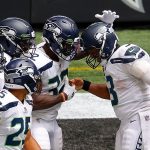 ATLANTA, GEORGIA - SEPTEMBER 13:  Russell Wilson #3 of the Seattle Seahawks celebrates with Chris Carson #32 after a touchdown against the Atlanta Falcons at Mercedes-Benz Stadium on September 13, 2020 in Atlanta, Georgia. (Photo by Kevin C. Cox/Getty Images)