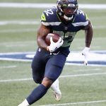 SEATTLE, WASHINGTON - SEPTEMBER 20: Chris Carson #32 of the Seattle Seahawks runs with the ball during the first half against the New England Patriots at CenturyLink Field on September 20, 2020 in Seattle, Washington. (Photo by Abbie Parr/Getty Images)
