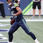 SEATTLE, WASHINGTON - SEPTEMBER 20: Tyler Lockett #16 of the Seattle Seahawks celebrates scoring a first quarter touchdown against the New England Patriots at CenturyLink Field on September 20, 2020 in Seattle, Washington. (Photo by Abbie Parr/Getty Images)