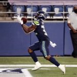 SEATTLE, WASHINGTON - SEPTEMBER 20: Chris Carson #32 of the Seattle Seahawks catches a touchdown pass during the fourth quarter against the New England Patriots at CenturyLink Field on September 20, 2020 in Seattle, Washington. (Photo by Abbie Parr/Getty Images)