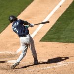 OAKLAND, CALIFORNIA - SEPTEMBER 26: J.P. Crawford #3 of the Seattle Mariners hits a single that scored a run against the Oakland Athletics in the eighth inning of game one of their double header at RingCentral Coliseum on September 26, 2020 in Oakland, California. (Photo by Ezra Shaw/Getty Images)