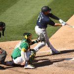 OAKLAND, CALIFORNIA - SEPTEMBER 26: Ty France #23 of the Seattle Mariners hits a single that scored a run against the Oakland Athletics in the eighth inning of game one of their double header at RingCentral Coliseum on September 26, 2020 in Oakland, California. (Photo by Ezra Shaw/Getty Images)