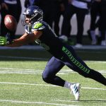 SEATTLE, WASHINGTON - SEPTEMBER 27: Tyler Lockett #16 of the Seattle Seahawks dives for a pass but fails to complete the catch against the Dallas Cowboys during the second quarter in the game at CenturyLink Field on September 27, 2020 in Seattle, Washington. (Photo by Abbie Parr/Getty Images)