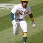 OAKLAND, CALIFORNIA - SEPTEMBER 27: Tony Kemp #5 of the Oakland Athletics rounds third base to score against the Seattle Mariners in the bottom of the seventh inning at RingCentral Coliseum on September 27, 2020 in Oakland, California. (Photo by Thearon W. Henderson/Getty Images)