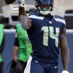 SEATTLE, WASHINGTON - SEPTEMBER 27: DK Metcalf #14 of the Seattle Seahawks celebrates after catching a 29 yard touchdown against Darian Thompson #23 of the Dallas Cowboys during the fourth quarter in the game at CenturyLink Field on September 27, 2020 in Seattle, Washington. (Photo by Abbie Parr/Getty Images)
