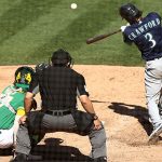 OAKLAND, CALIFORNIA - SEPTEMBER 26:  J.P. Crawford #3 of the Seattle Mariners hits a single that scored a run against the Oakland Athletics in the sixth inning of game one of their double header at RingCentral Coliseum on September 26, 2020 in Oakland, California. (Photo by Ezra Shaw/Getty Images)