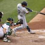OAKLAND, CALIFORNIA - SEPTEMBER 26: Phillip Ervin #20 of the Seattle Mariners hits a single that scored a run against the Oakland Athletics in the third inning of their second game of a double header at RingCentral Coliseum on September 26, 2020 in Oakland, California. (Photo by Ezra Shaw/Getty Images)