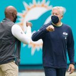 MIAMI GARDENS, FLORIDA - OCTOBER 04: Head coach Brian Flores of the Miami Dolphins greets head coach Pete Carroll of the Seattle Seahawks prior to the game at Hard Rock Stadium on October 04, 2020 in Miami Gardens, Florida. (Photo by Michael Reaves/Getty Images)