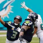 MIAMI GARDENS, FLORIDA - OCTOBER 04: Russell Wilson #3 of the Seattle Seahawks throws a pass against the Miami Dolphins during the first half at Hard Rock Stadium on October 04, 2020 in Miami Gardens, Florida. (Photo by Michael Reaves/Getty Images)