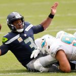MIAMI GARDENS, FLORIDA - OCTOBER 04: Russell Wilson #3 of the Seattle Seahawks is sacked against the Miami Dolphins during the second quarter at Hard Rock Stadium on October 04, 2020 in Miami Gardens, Florida. (Photo by Michael Reaves/Getty Images)