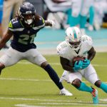MIAMI GARDENS, FLORIDA - OCTOBER 04: Jakeem Grant #19 of the Miami Dolphins catches a pass against Tre Flowers #21 of the Seattle Seahawks during the first half at Hard Rock Stadium on October 04, 2020 in Miami Gardens, Florida. (Photo by Michael Reaves/Getty Images)