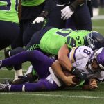 SEATTLE, WASHINGTON - OCTOBER 11: Kirk Cousins #8 of the Minnesota Vikings is tackled by Cody Barton #57 of the Seattle Seahawks during the second quarter at CenturyLink Field on October 11, 2020 in Seattle, Washington. (Photo by Abbie Parr/Getty Images)