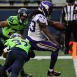 SEATTLE, WASHINGTON - OCTOBER 11: Dalvin Cook #33 of the Minnesota Vikings scores a touchdown against Quandre Diggs #37 of the Seattle Seahawks during the first quarter at CenturyLink Field on October 11, 2020 in Seattle, Washington. (Photo by Abbie Parr/Getty Images)