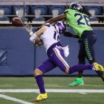 SEATTLE, WASHINGTON - OCTOBER 11: Shaquill Griffin #26 of the Seattle Seahawks breaks up a pass against Adam Thielen #19 of the Minnesota Vikings during the second quarter at CenturyLink Field on October 11, 2020 in Seattle, Washington. (Photo by Abbie Parr/Getty Images)