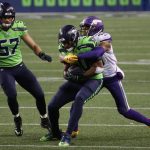 SEATTLE, WASHINGTON - OCTOBER 11: K.J. Wright #50 of the Seattle Seahawks is tackled by Justin Jefferson #18 of the Minnesota Vikings after intercepting a pass during the third quarter at CenturyLink Field on October 11, 2020 in Seattle, Washington. (Photo by Abbie Parr/Getty Images)