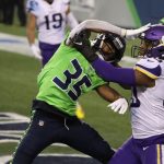 SEATTLE, WASHINGTON - OCTOBER 11: Ryan Neal #35 of the Seattle Seahawks breaks up a pass intended for C.J. Ham #30 of the Minnesota Vikings during the third quarter at CenturyLink Field on October 11, 2020 in Seattle, Washington. (Photo by Abbie Parr/Getty Images)