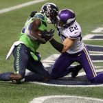 SEATTLE, WASHINGTON - OCTOBER 11: DK Metcalf #14 of the Seattle Seahawks catches the game winning touchdown pass against Harrison Smith #22 of the Minnesota Vikings during the fourth quarter at CenturyLink Field on October 11, 2020 in Seattle, Washington. (Photo by Abbie Parr/Getty Images)