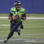 SEATTLE, WASHINGTON - OCTOBER 11: Russell Wilson #3 of the Seattle Seahawks rolls out to pass against the Minnesota Vikings  during the fourth quarter at CenturyLink Field on October 11, 2020 in Seattle, Washington. (Photo by Abbie Parr/Getty Images)