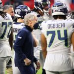 GLENDALE, ARIZONA - OCTOBER 25: Head coach Pete Carroll of the Seattle Seahawks stands with his players on the field during pre-game warm-up before the game against the Arizona Cardinals at State Farm Stadium on October 25, 2020 in Glendale, Arizona. (Photo by Christian Petersen/Getty Images)