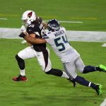 GLENDALE, ARIZONA - OCTOBER 25: Dan Arnold #85 of the Arizona Cardinals runs with the ball against a tackle by Bobby Wagner #54 of the Seattle Seahawks during the second half at State Farm Stadium on October 25, 2020 in Glendale, Arizona. (Photo by Norm Hall/Getty Images)