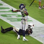 GLENDALE, ARIZONA - OCTOBER 25: Tyler Lockett #16 of the Seattle Seahawks reacts after catching a touchdown against Patrick Peterson #21 of the Arizona Cardinals during the second quarter at State Farm Stadium on October 25, 2020 in Glendale, Arizona. (Photo by Norm Hall/Getty Images)