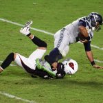 GLENDALE, ARIZONA - OCTOBER 25: Byron Murphy Jr #33 of the Arizona Cardinals sacks Russell Wilson #3 of the Seattle Seahawks during overtime at State Farm Stadium on October 25, 2020 in Glendale, Arizona. The Cardinals won 37-34. (Photo by Norm Hall/Getty Images)