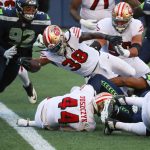 SEATTLE, WASHINGTON - NOVEMBER 01: JaMycal Hasty #38 of the San Francisco 49ers scores a touchdown against Bryan Mone #92 of the Seattle Seahawks in the second quarter of the game at CenturyLink Field on November 01, 2020 in Seattle, Washington. (Photo by Abbie Parr/Getty Images)