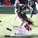 SEATTLE, WASHINGTON - NOVEMBER 01: DK Metcalf #14 of the Seattle Seahawks is tackled by Jason Verrett #22 of the San Francisco 49ers the first quarter at CenturyLink Field on November 01, 2020 in Seattle, Washington. (Photo by Abbie Parr/Getty Images)