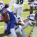 ORCHARD PARK, NEW YORK - NOVEMBER 08: Andre Roberts #18 of the Buffalo Bills is tackled by Ben Burr-Kirven #55 and Cody Barton #57 of the Seattle Seahawks during the first half at Bills Stadium on November 08, 2020 in Orchard Park, New York. (Photo by Bryan M. Bennett/Getty Images)
