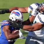 ORCHARD PARK, NEW YORK - NOVEMBER 08: Zack Moss #20 of the Buffalo Bills carries the ball as Bobby Wagner #54 of the Seattle Seahawks defends during the first half at Bills Stadium on November 08, 2020 in Orchard Park, New York. (Photo by Timothy T Ludwig/Getty Images)