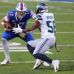 ORCHARD PARK, NEW YORK - NOVEMBER 08: Josh Allen #17 of the Buffalo Bills carries the ball as Jordyn Brooks #56 of the Seattle Seahawks defends during the second half at Bills Stadium on November 08, 2020 in Orchard Park, New York. (Photo by Timothy T Ludwig/Getty Images)