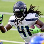 INGLEWOOD, CALIFORNIA - NOVEMBER 15: Alex Collins #41 of the Seattle Seahawks carries the ball for a touchdown against the Los Angeles Rams in the first quarter at SoFi Stadium on November 15, 2020 in Inglewood, California. (Photo by Joe Scarnici/Getty Images)