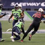 SEATTLE, WASHINGTON - NOVEMBER 19: Quandre Diggs #37 of the Seattle Seahawks knocks the ball away from Dan Arnold #85 of the Arizona Cardinals in the second quarter at Lumen Field on November 19, 2020 in Seattle, Washington. (Photo by Abbie Parr/Getty Images)