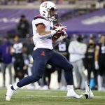 SEATTLE, WASHINGTON - NOVEMBER 21: Jalen John #21 of the Arizona Wildcats runs with the ball as his shoe falls off in the fourth quarter against the Washington Huskies at Husky Stadium on November 21, 2020 in Seattle, Washington. (Photo by Abbie Parr/Getty Images)